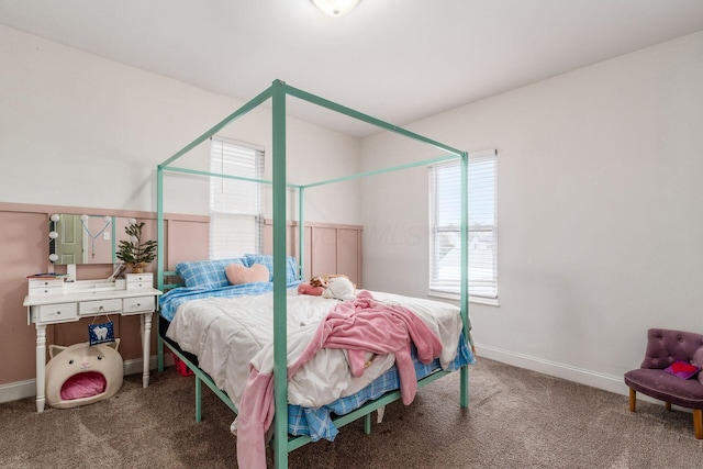 carpeted bedroom featuring multiple windows