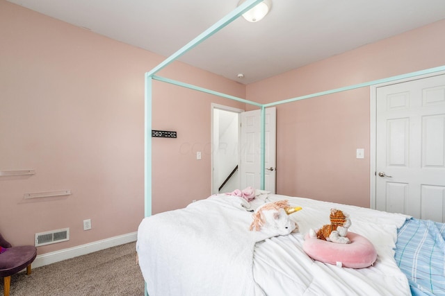 bedroom featuring light colored carpet