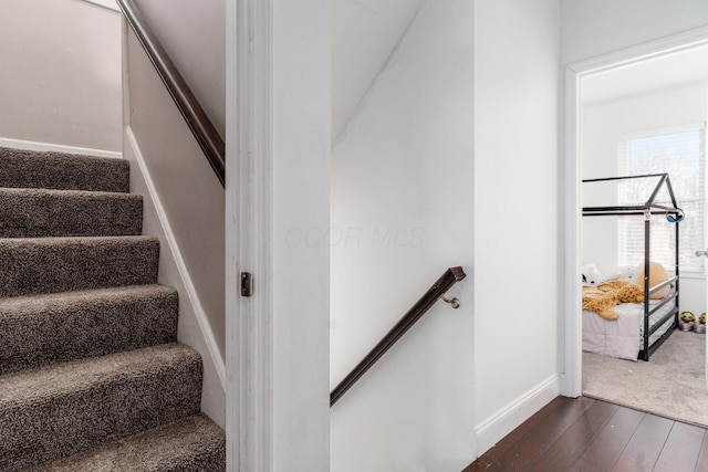 stairs with wood-type flooring