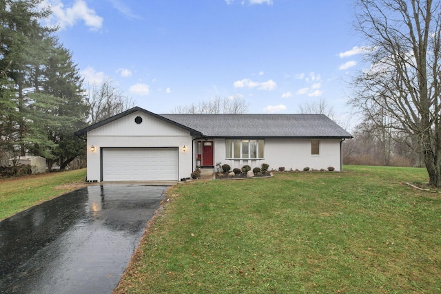 single story home featuring a garage and a front yard