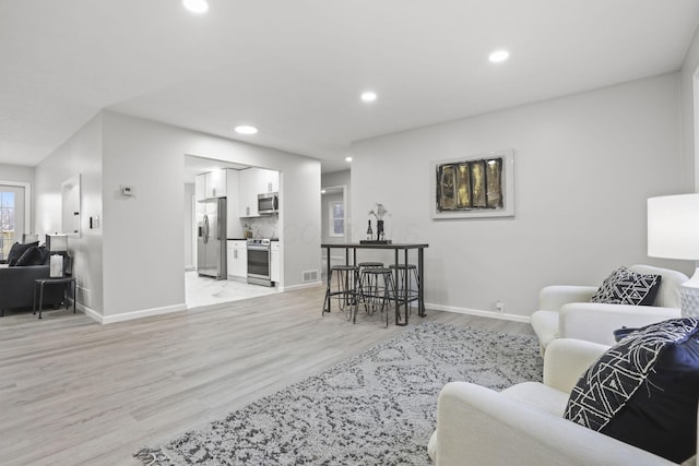 living room featuring light hardwood / wood-style floors