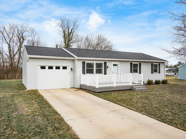 ranch-style house featuring a garage and a front lawn