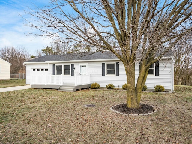 single story home featuring a garage and a front yard