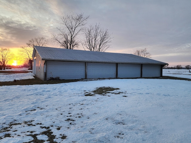 view of snow covered garage