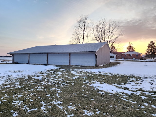 view of snow covered garage