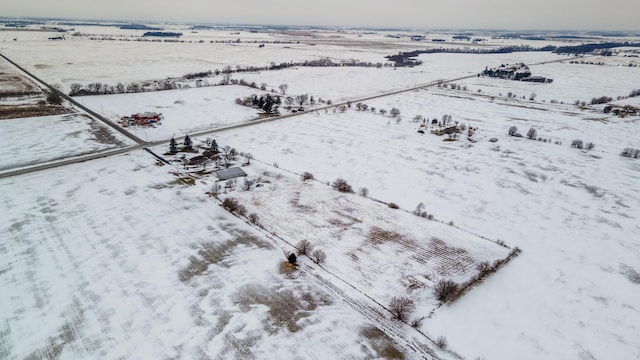 snowy aerial view with a rural view