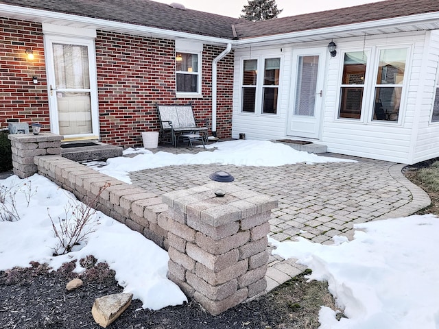 view of snow covered patio