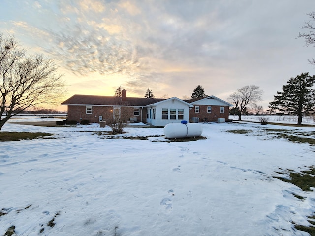 view of snow covered house