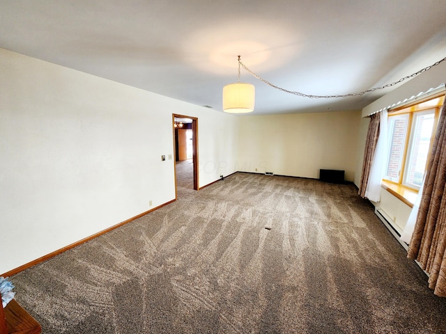 carpeted empty room with a baseboard radiator