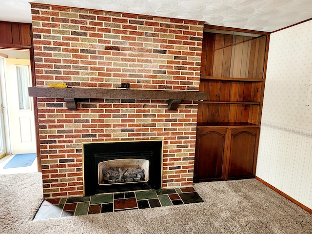 details with a fireplace, wood walls, and carpet