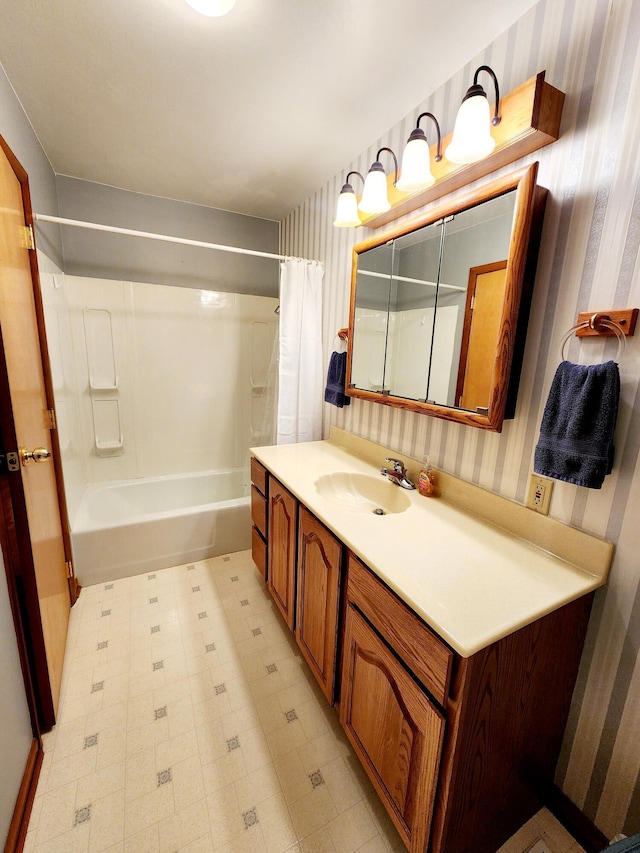 bathroom with shower / bath combo and vanity