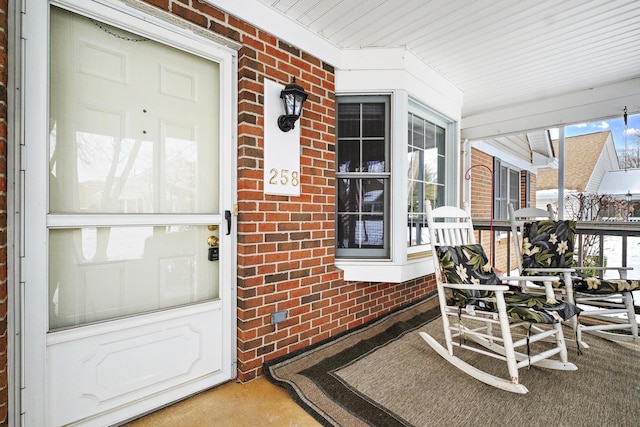 doorway to property with covered porch