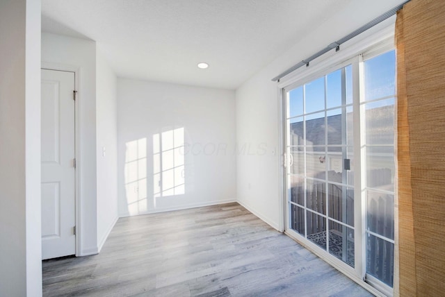 spare room with light wood-type flooring