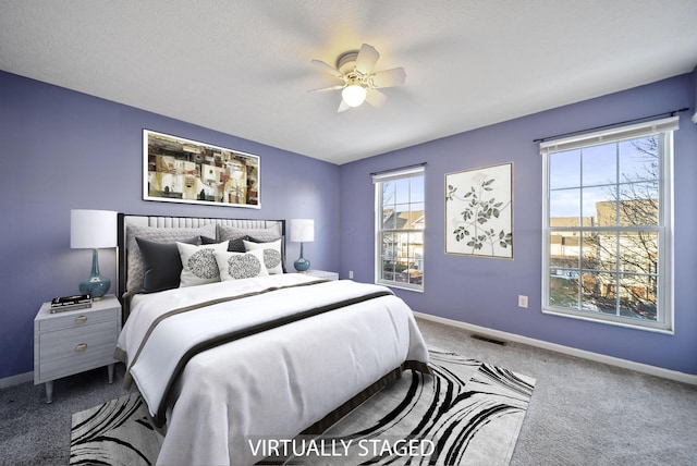 carpeted bedroom featuring ceiling fan