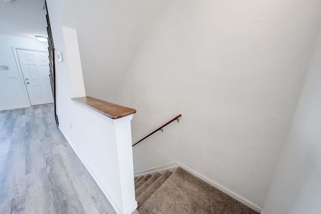 stairway featuring hardwood / wood-style flooring