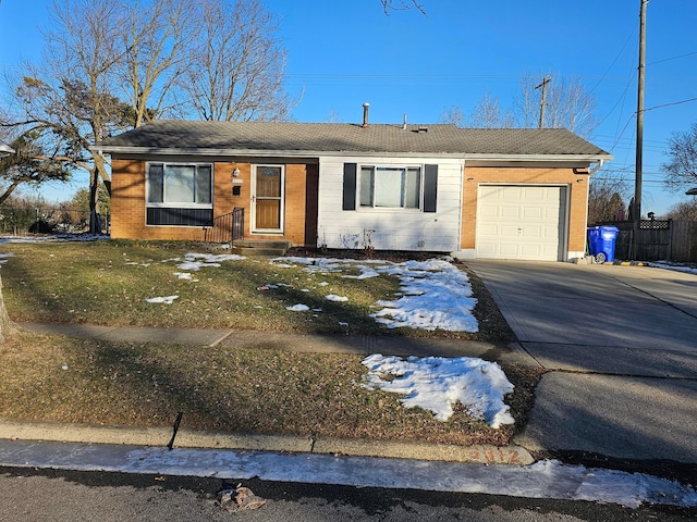 single story home with a garage and a front yard