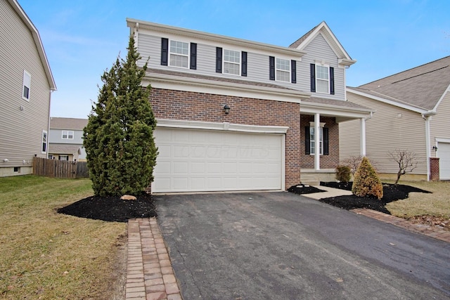 front of property featuring a garage and a front lawn