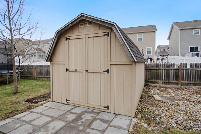 view of outbuilding featuring a trampoline