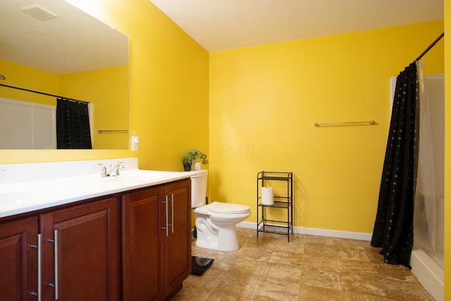 full bathroom featuring vanity, toilet, and shower / tub combo