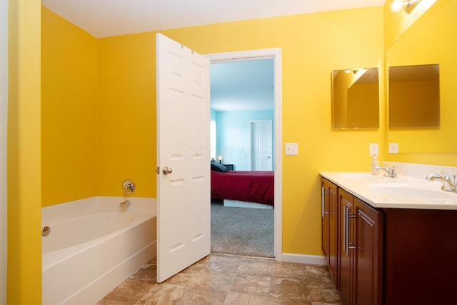 bathroom with vanity and a bath