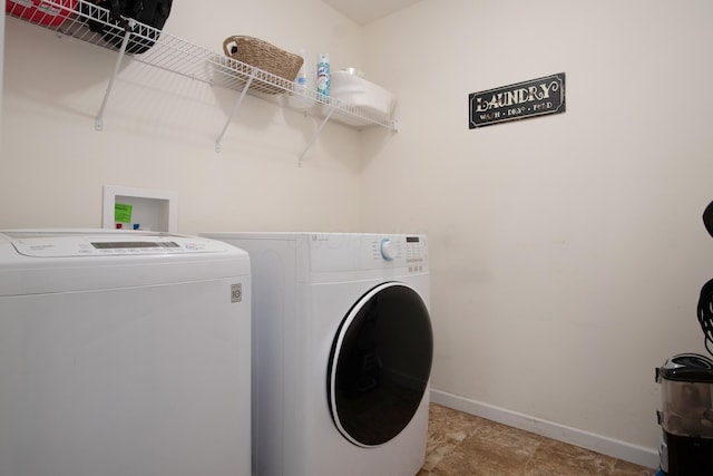 laundry room with independent washer and dryer