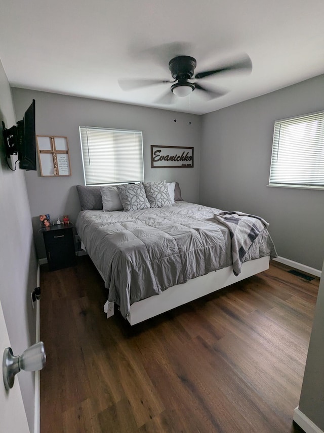 bedroom featuring dark hardwood / wood-style floors and ceiling fan