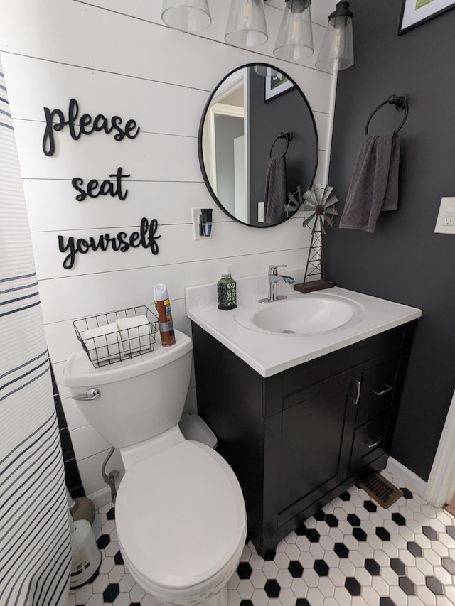 bathroom with toilet and vanity