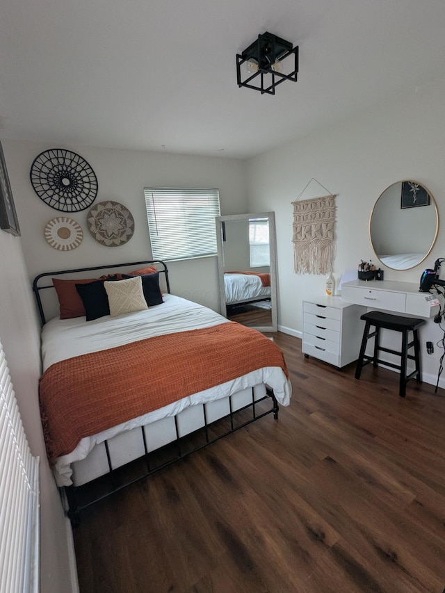 bedroom featuring dark hardwood / wood-style flooring