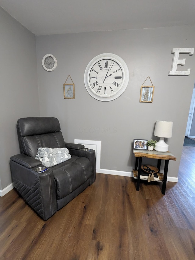 sitting room with dark hardwood / wood-style floors