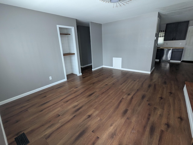 unfurnished living room featuring dark hardwood / wood-style flooring