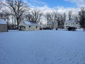 view of yard covered in snow