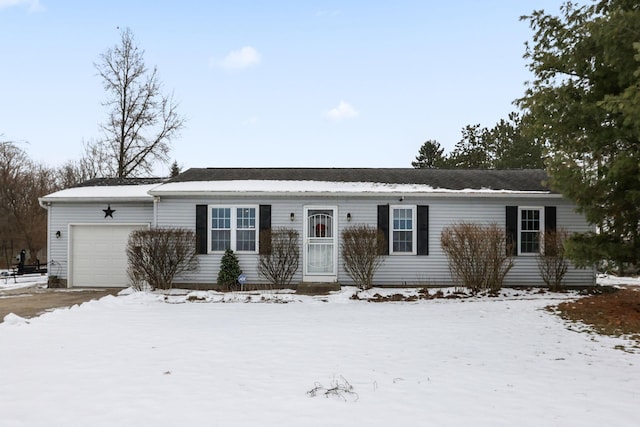 ranch-style home featuring a garage