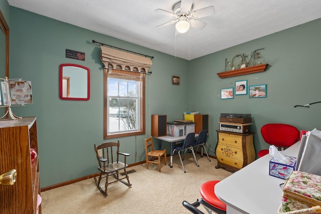 bedroom featuring carpet floors, a textured ceiling, and ceiling fan