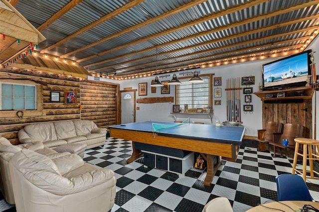 recreation room featuring rustic walls