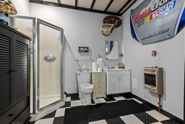 bathroom with heating unit, vanity, a shower with door, and toilet