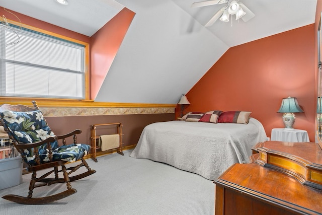 bedroom with lofted ceiling, ceiling fan, and carpet