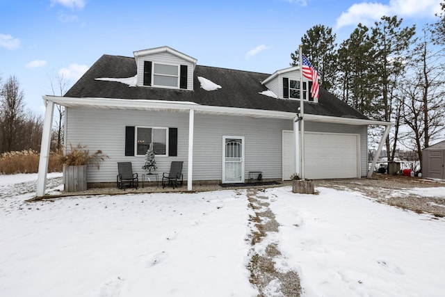 view of front of property with a garage and covered porch