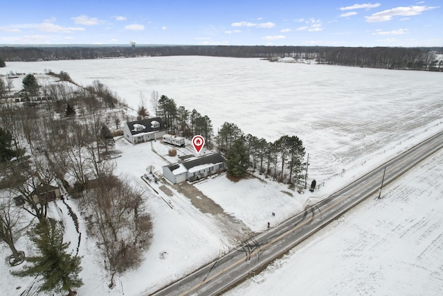 snowy aerial view featuring a rural view