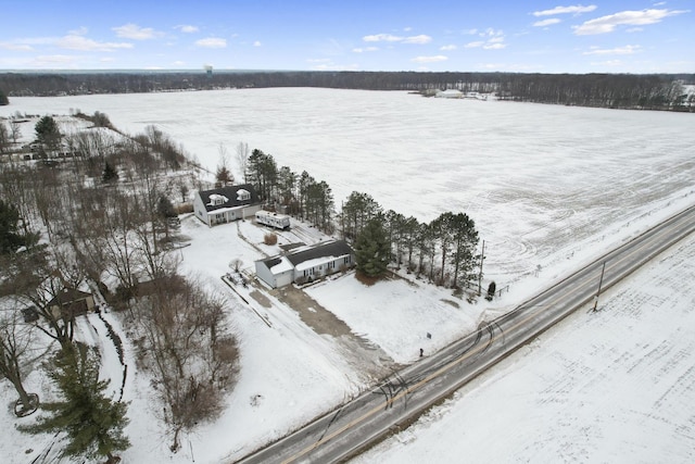 snowy aerial view featuring a rural view