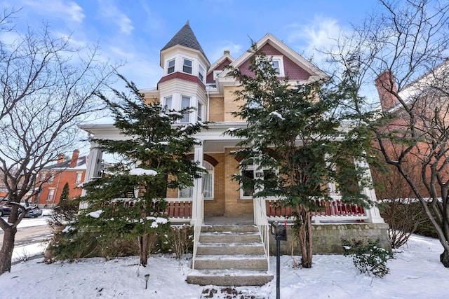 victorian home with brick siding