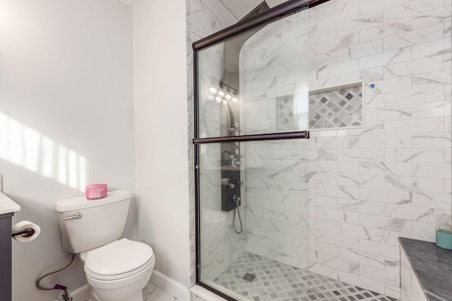 bathroom featuring an enclosed shower, vanity, and toilet