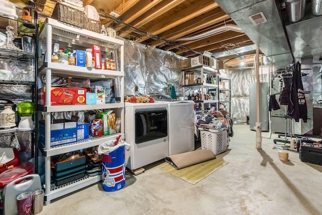 basement with separate washer and dryer and water heater