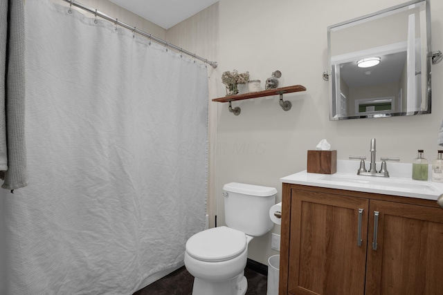 bathroom featuring vanity and toilet