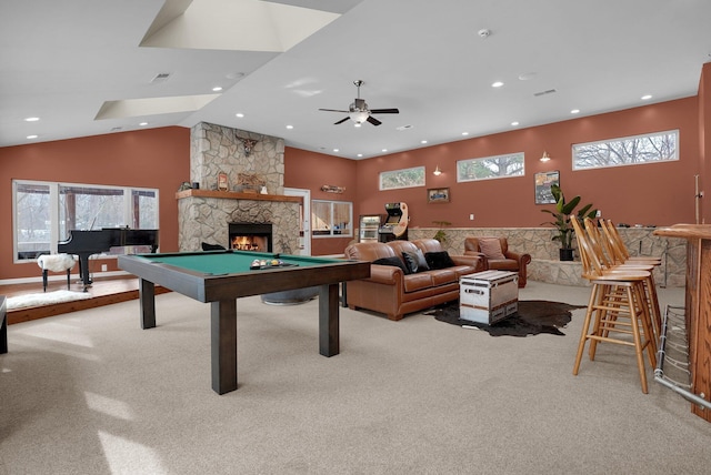 recreation room with high vaulted ceiling, light colored carpet, a fireplace, and pool table