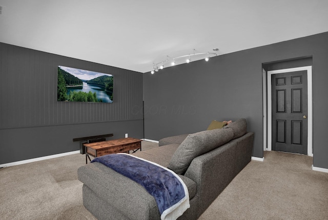 home theater room featuring track lighting, carpet flooring, visible vents, and baseboards