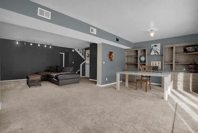 living room with stairs, baseboards, visible vents, and light colored carpet