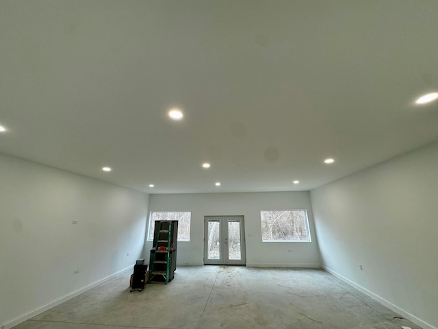 spare room featuring baseboards, french doors, and recessed lighting