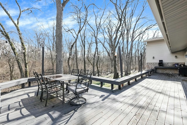 wooden deck with outdoor dining space