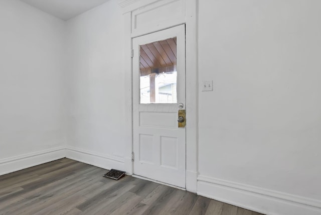 doorway featuring dark hardwood / wood-style floors