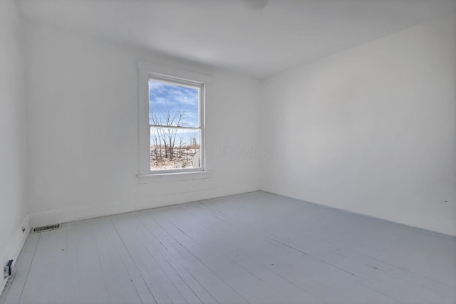 spare room with light hardwood / wood-style floors